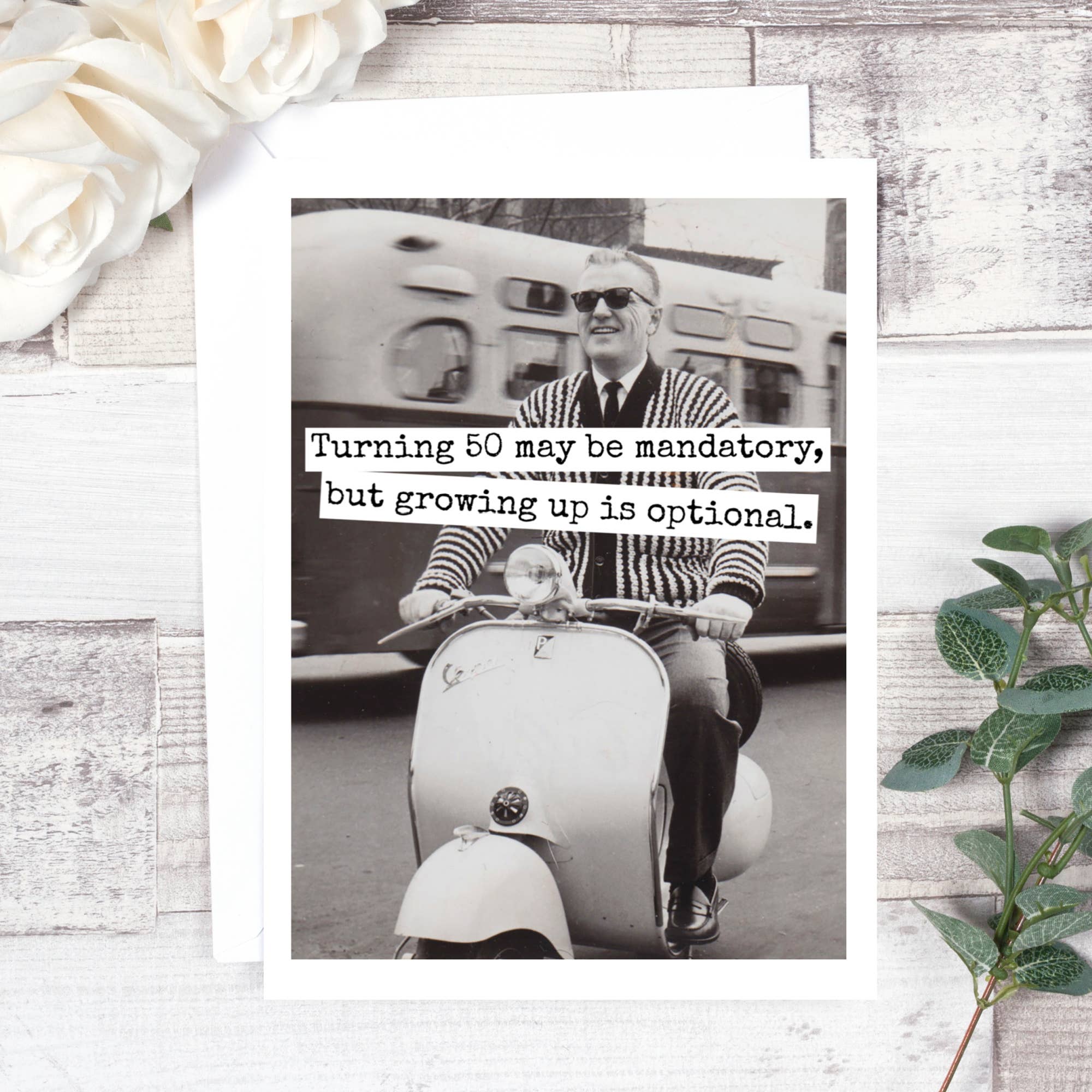 Raven's Rest Studio greeting card with vintage black-and-white image of man on scooter and humorous 50th birthday quote, blank inside, glossy front and matte interior.