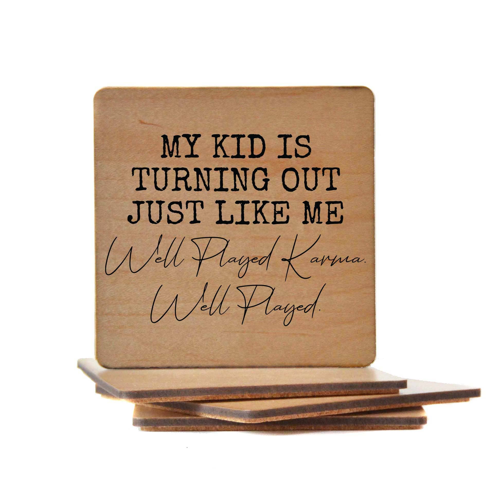 Wooden coaster with "My Kid Is Turning Out Just Like Me Well Played" humorous text and cork backing
