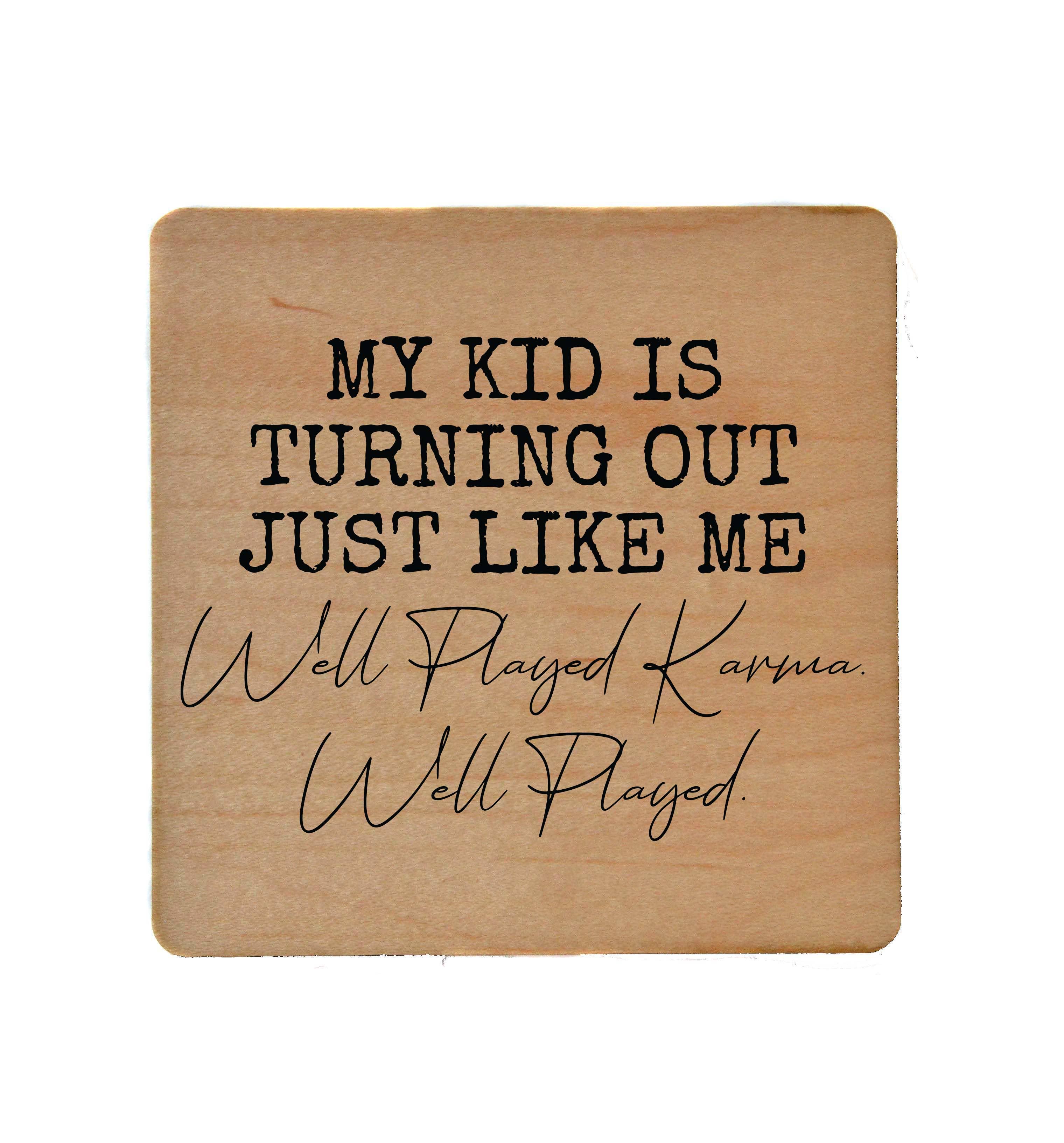 Wooden coaster with "My Kid Is Turning Out Just Like Me Well Played" humorous text and cork backing