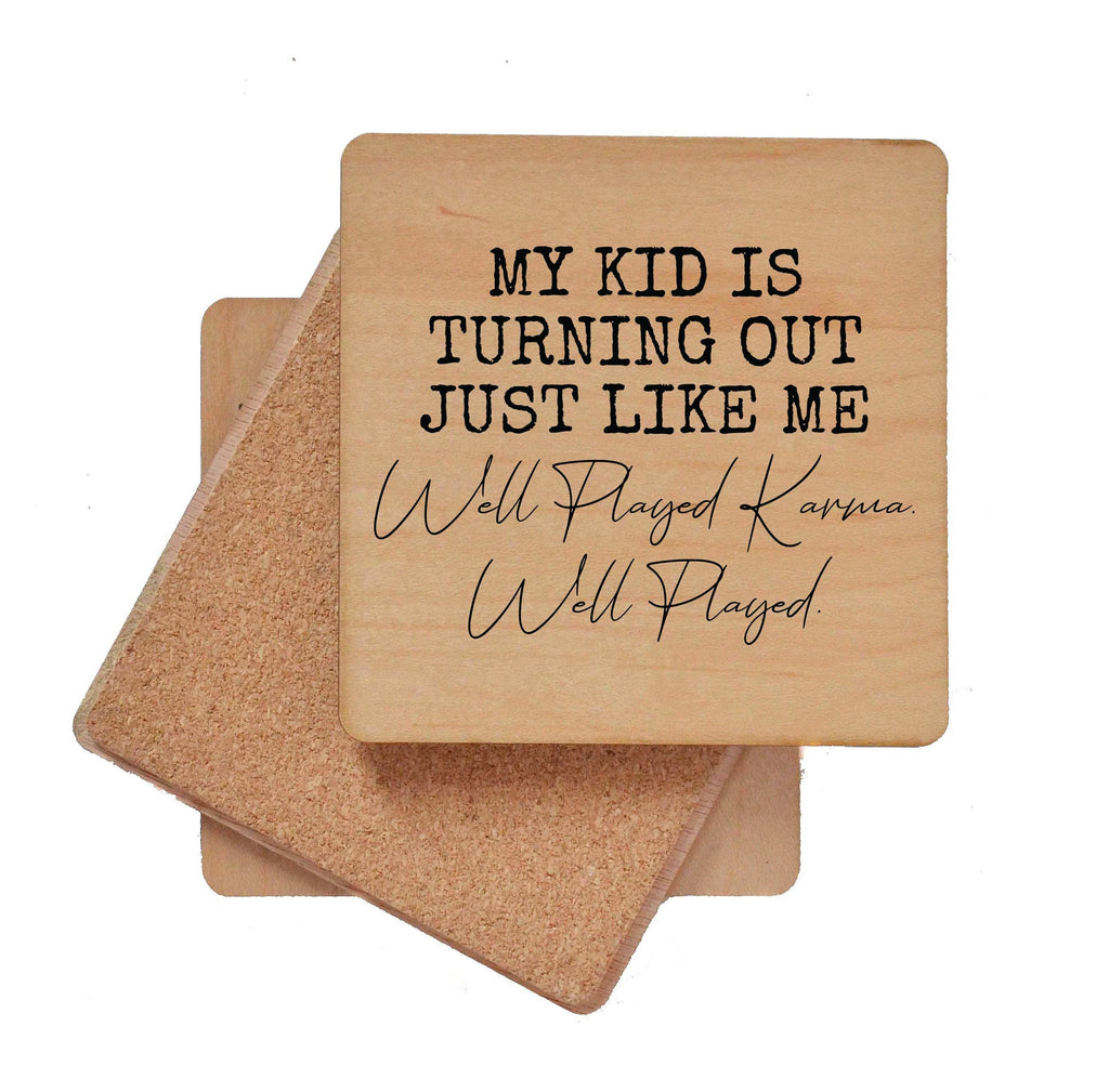 Wood coaster with cork backing and humorous text "My Kid Is Turning Out Just Like Me Well Played Karma Well Played"