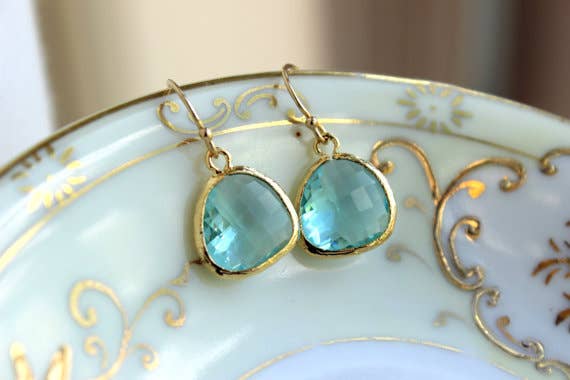 Aquamarine blue earrings with 16k gold plated glass gems and 14k gold filled earwires on decorative plate