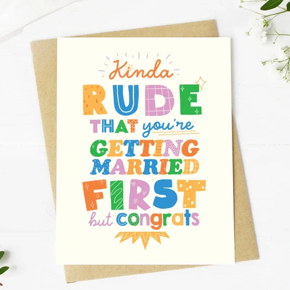 Colorful hand-drawn Big Mood Card with playful text "Kinda rude that you're getting married first but congrats" on premium matte cardstock with kraft envelope.