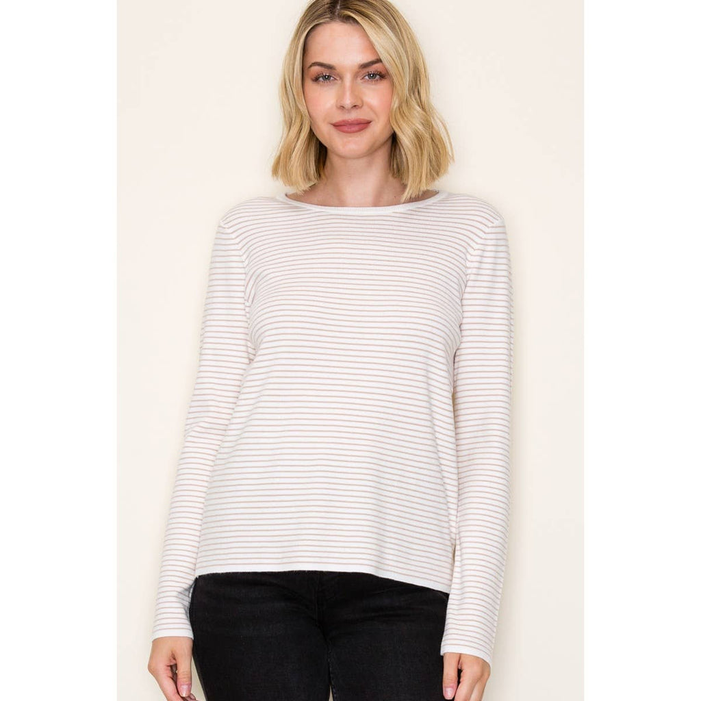 Woman wearing ivory and taupe long sleeve pinstripe top with crew neckline and relaxed fit