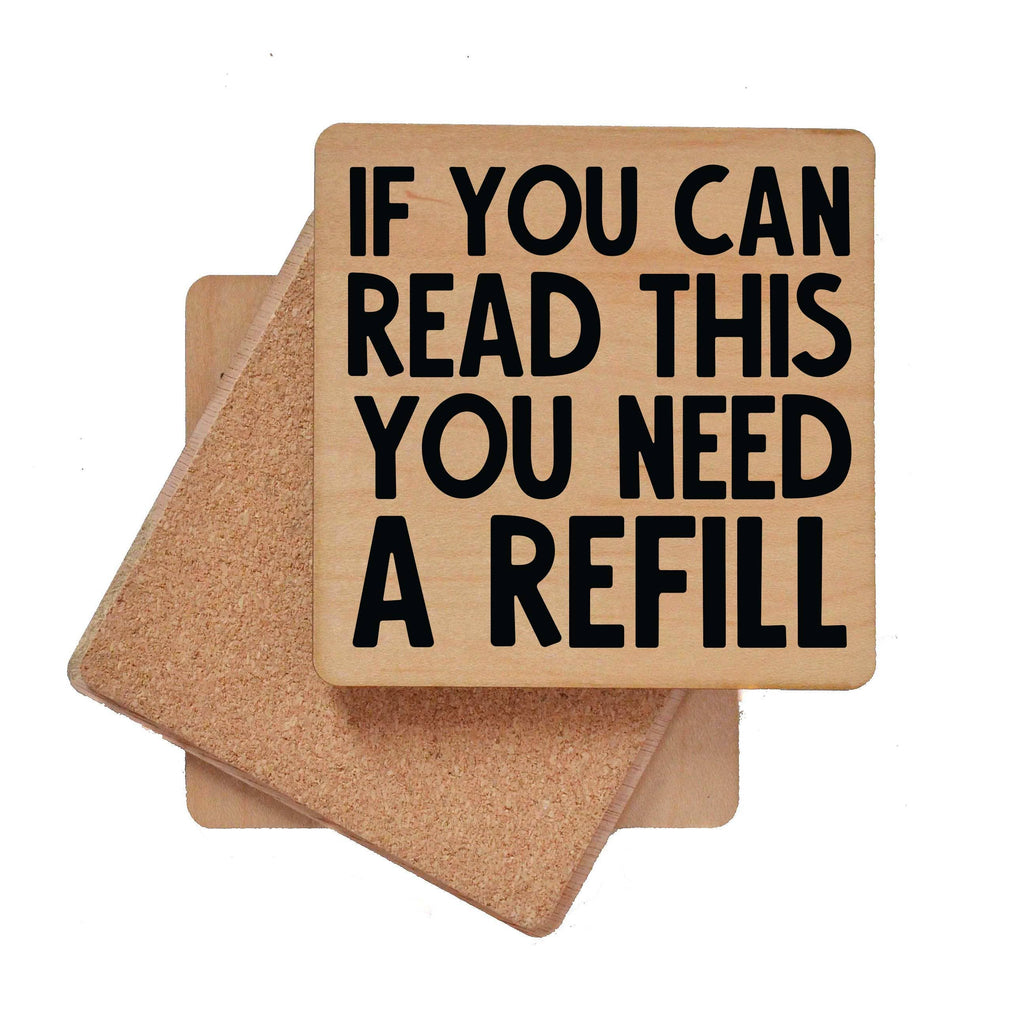 Wooden bar coaster with "If You Can Read This You Need A Refill" text and cork backing