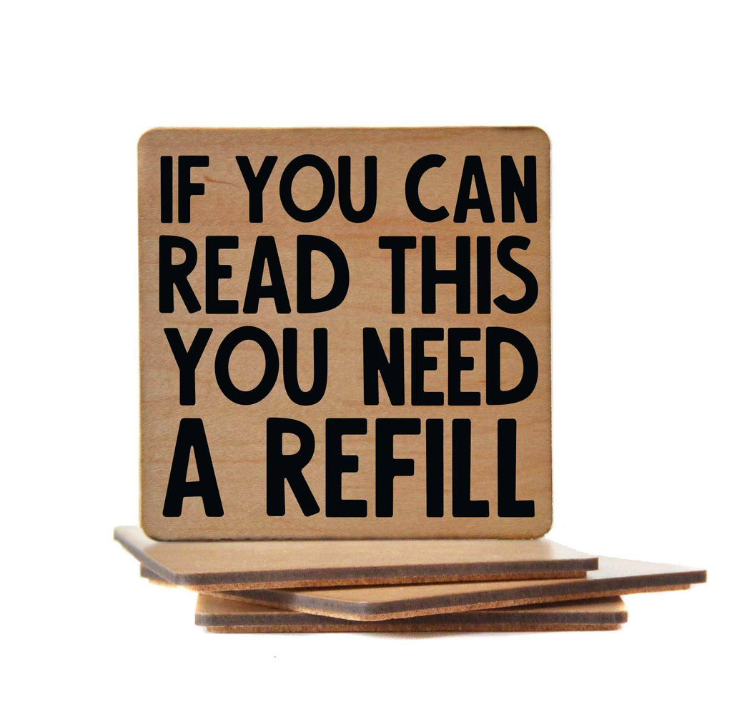 Funny wooden bar coaster with "If You Can Read This You Need A Refill" text and cork backing