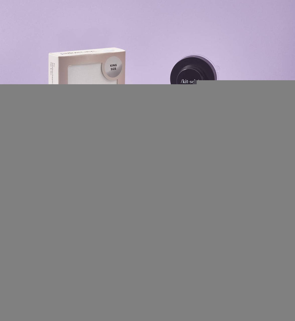 Self-draining shower caddy with rust-proof coating holding shampoo and conditioner bars, eco-friendly recycled material.