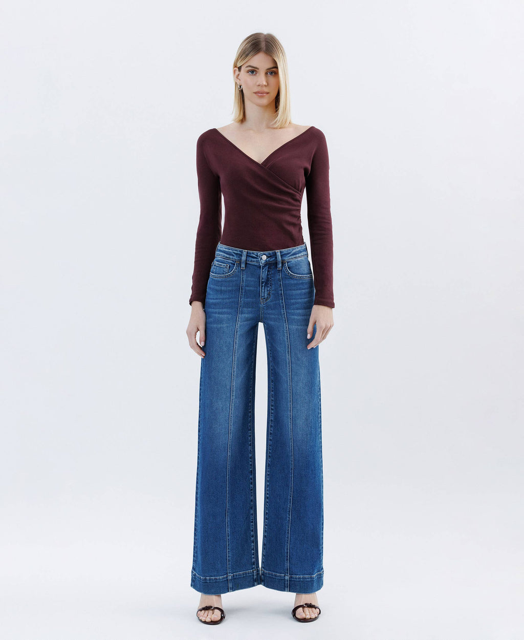 Woman wearing high rise Wide Leg Jeans trouser wide leg pleated blue jeans and maroon top