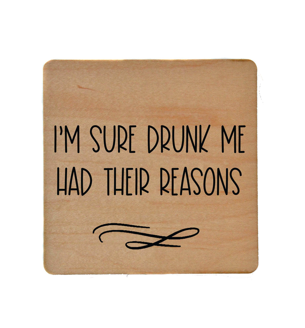 Drunk Me Had Their Reasons wooden coaster with humorous text and cork backing.