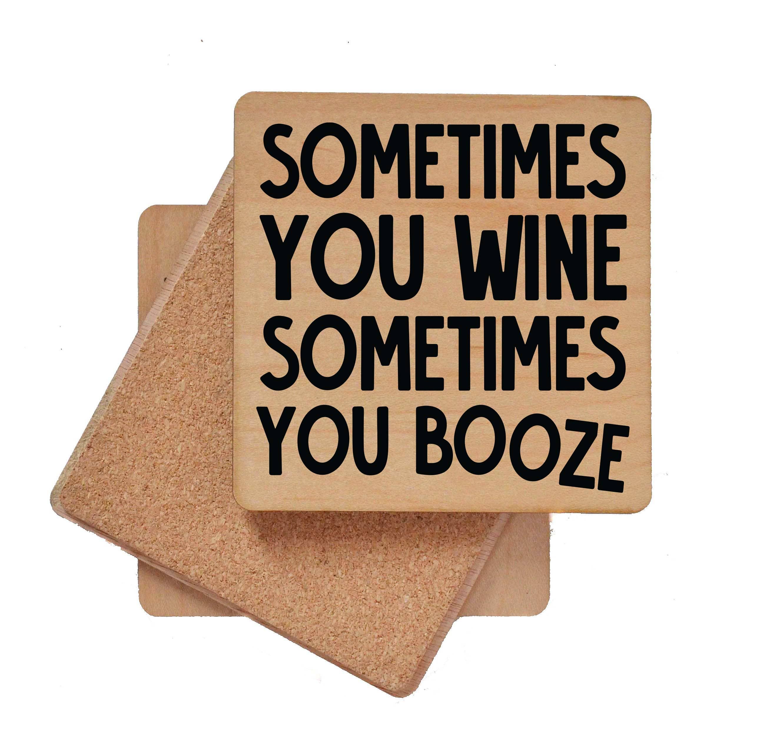 Wooden bar coaster with cork backing and black text "Sometimes You Wine Sometimes You Booze" for home bar use