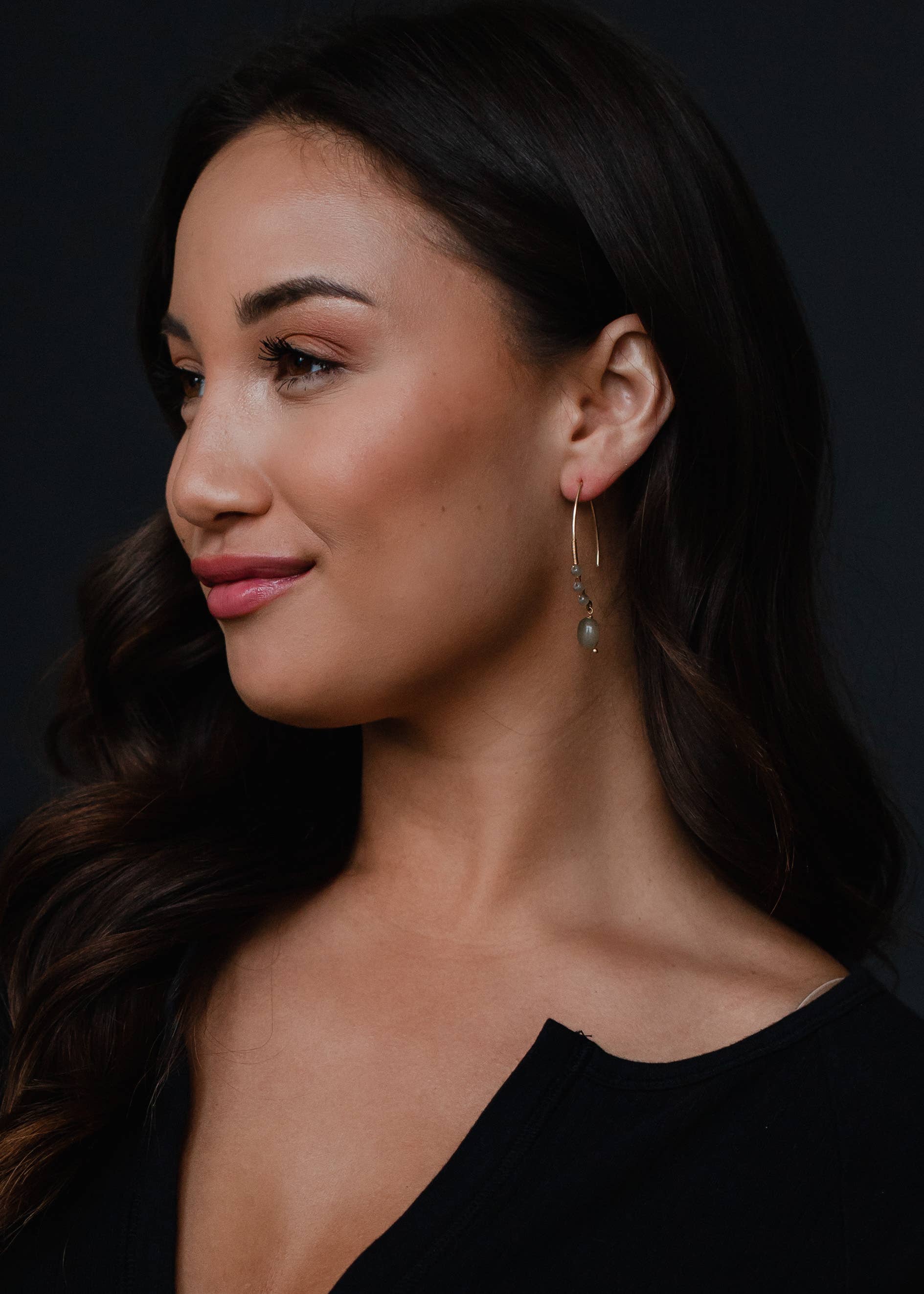Woman wearing gold detail beaded dangles earrings 2-inch length lead and nickel free