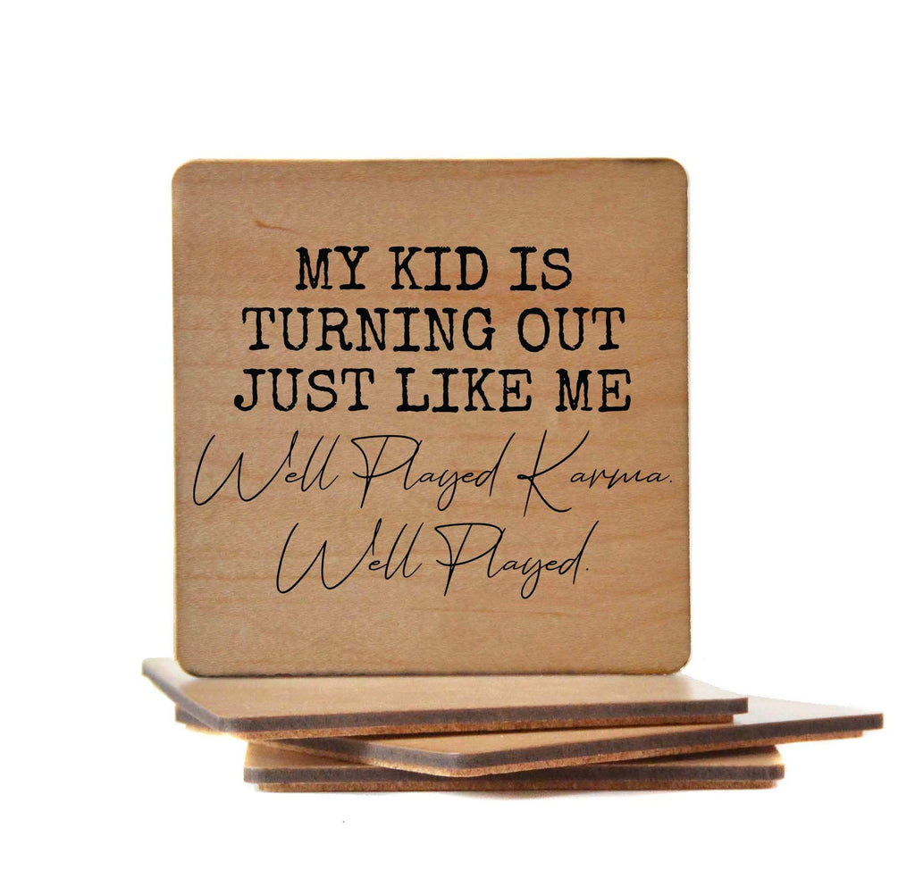 Wooden coaster with "My Kid Is Turning Out Just Like Me Well Played" humorous text and cork backing