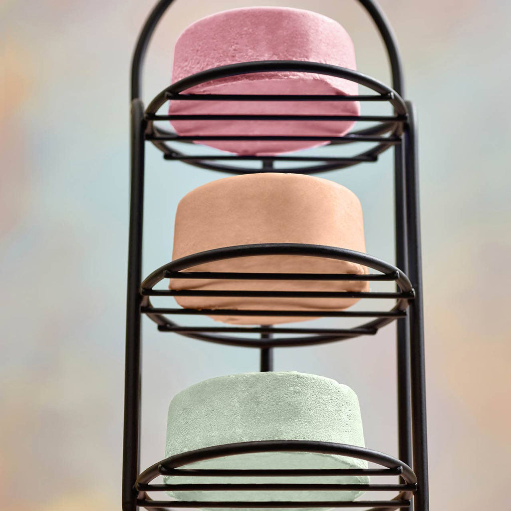 Self-draining shower caddy with three tiers holding colorful soap bars, rust-proof coated and eco-friendly design