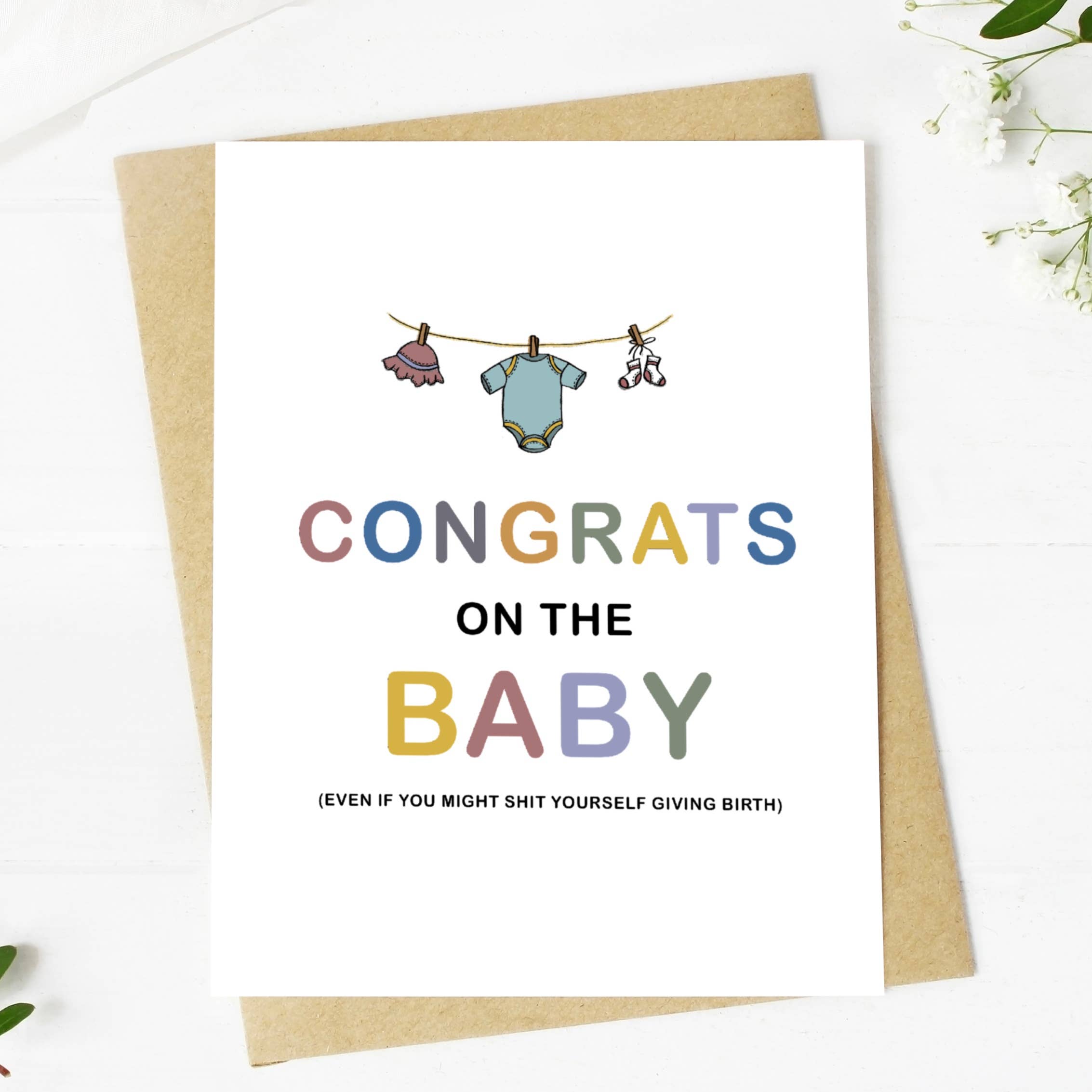 Big Mood Cards baby congratulations card with hand-drawn clothesline design and kraft envelope.